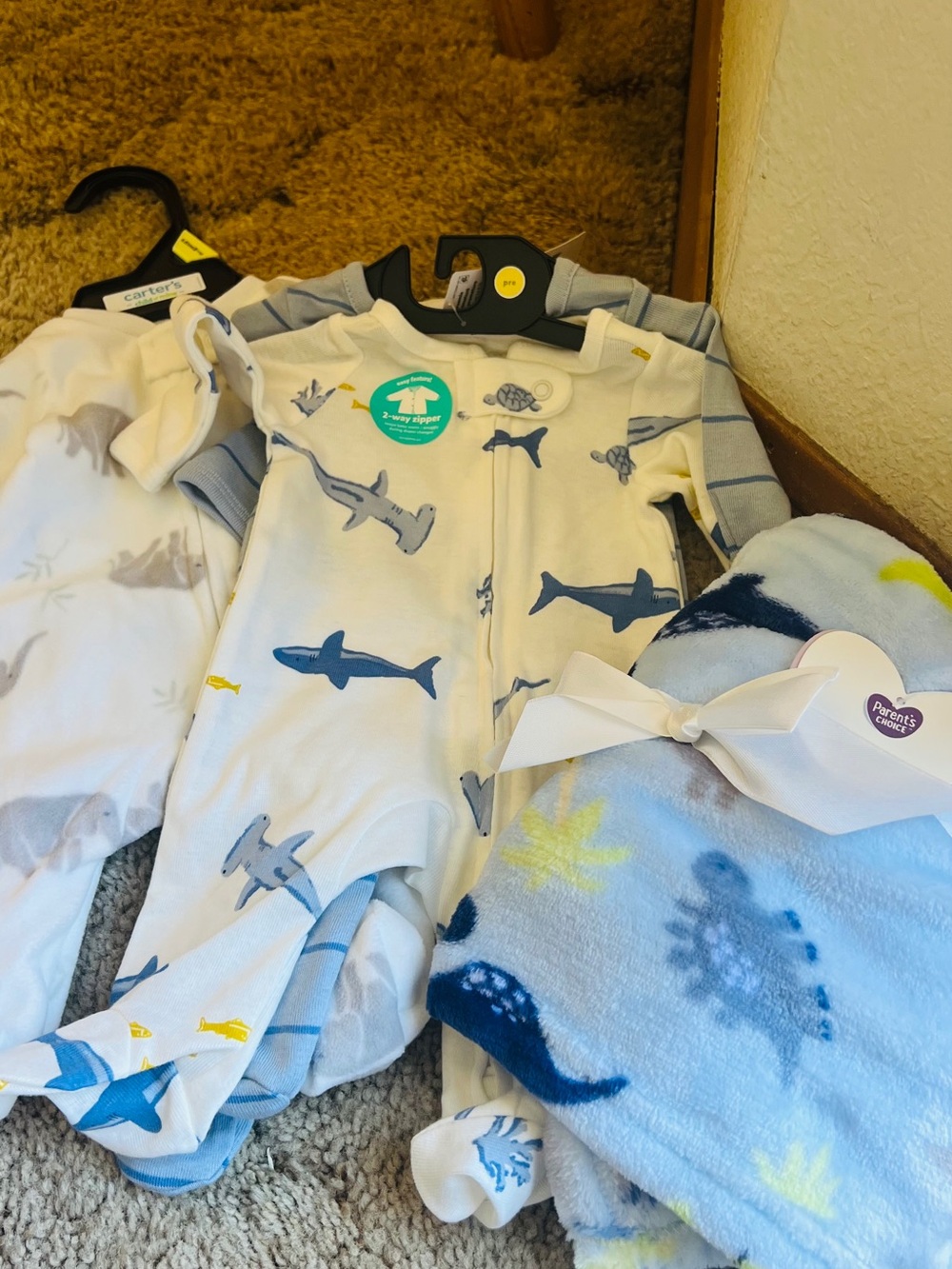 Carter's one-piece footie premie set of three baby pajamas and 1 blanket.